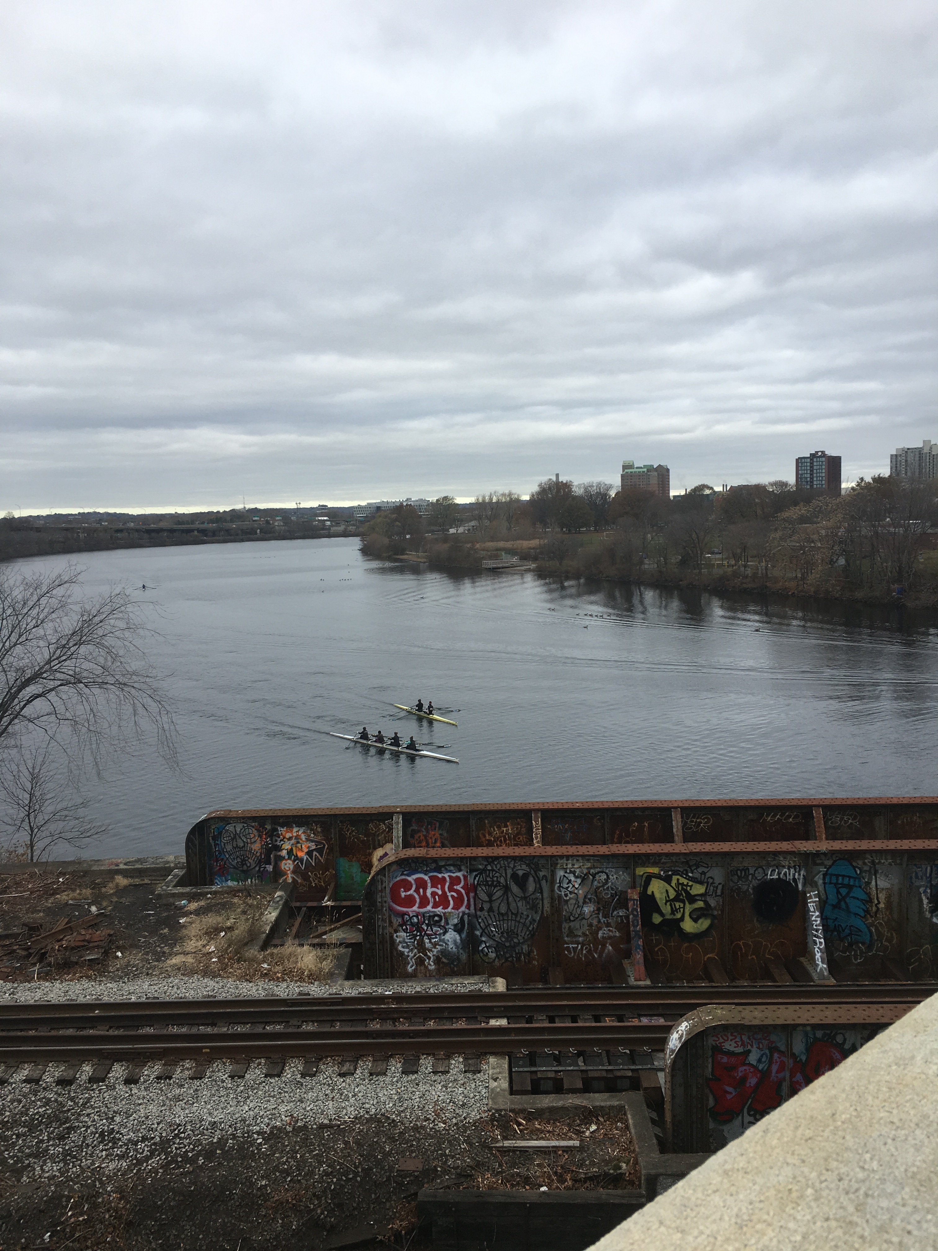 Two crew rowing on the Charles River from the Boston University Bridge