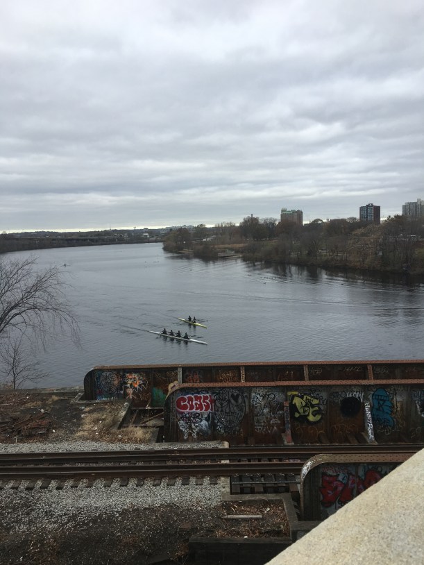 Two crew rowing on the Charles River from the Boston University Bridge
